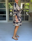 Dress with V-neck and three-quarter sleeves