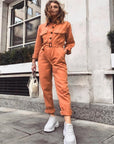 Elegant Orange Jumpsuit with Flattering Fit and Feminine Flair