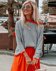 Elegant knitted women's sweater with loose stripes - Angelien